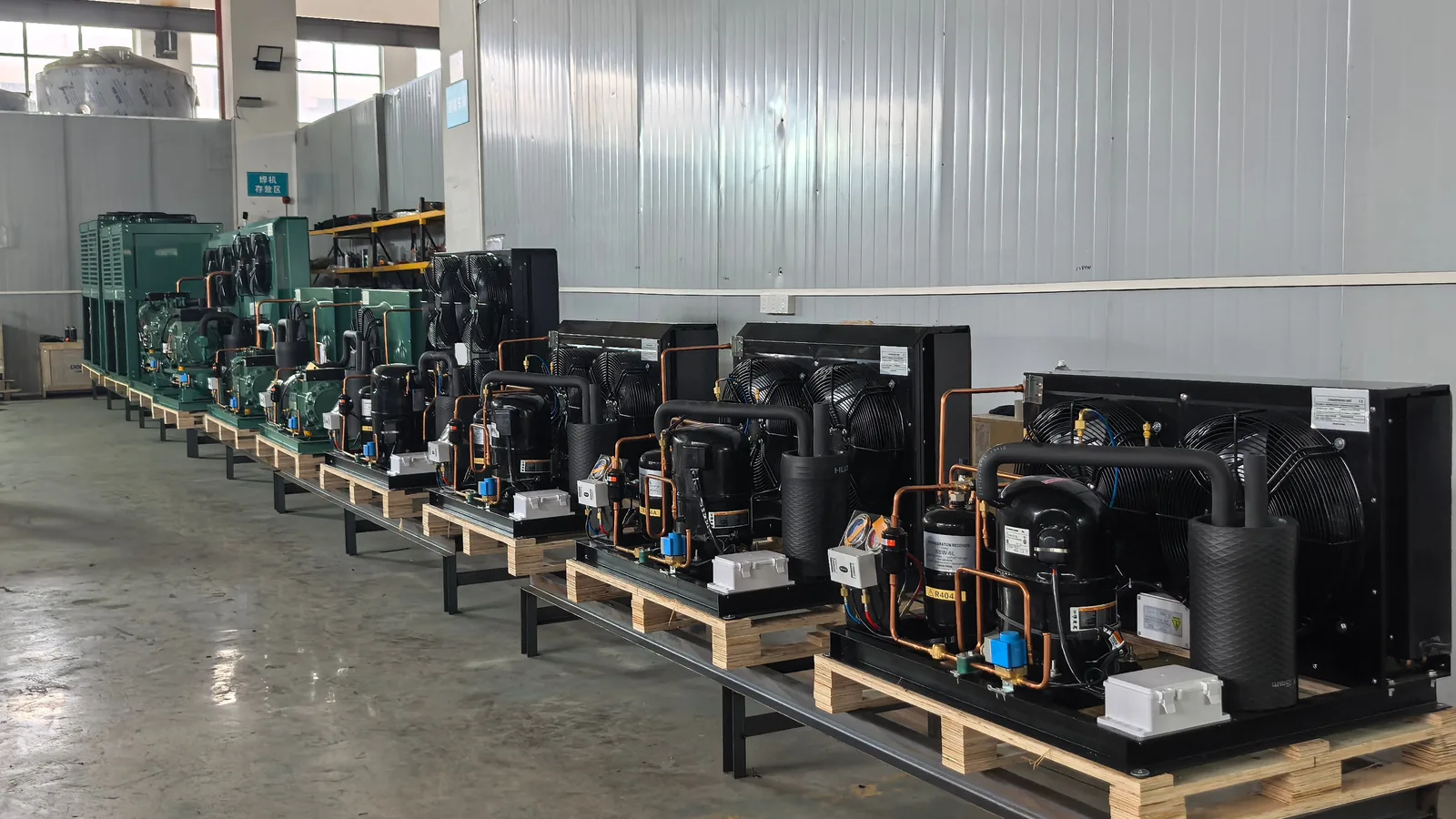 row of BesCool condensing units on the factory floor ready for export